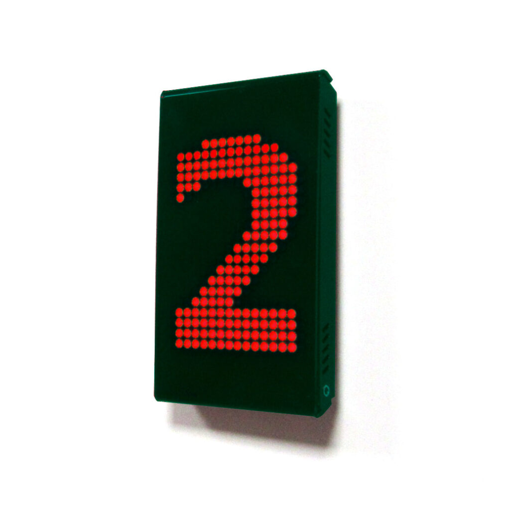Wall-mounted red LED queue display showing the number 2