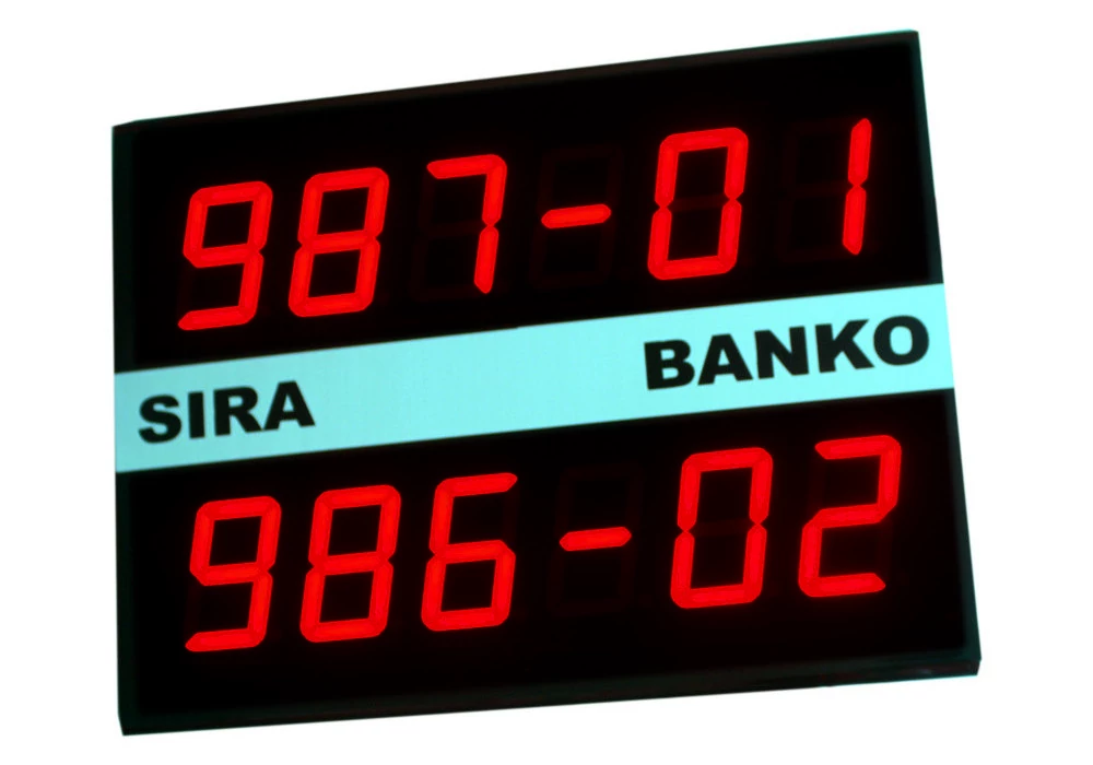 Dual-line LED queue display showing ticket numbers and counter assignments